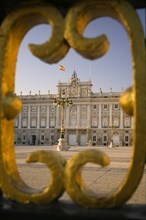 SPAIN, Madrid, The Palacio Real. The Royal Palace seen through a section of the main gates.