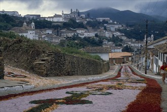 BRAZIL, Religion, Easter, Easter Day parade route leading down hill towards town carpeted with