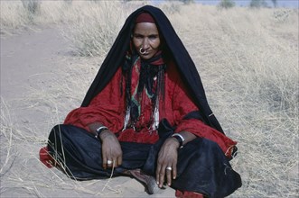 CHAD, People, Bororo, Portrait of nomadic Bororo lady with braided hair and traditional jewellery.
