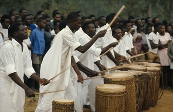 RWANDA, Music, Tutsi drummers playing to crowd.