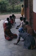 RWANDA, People, Children, Tutsi children playing game with stones.