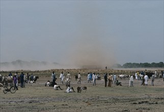 SUDAN, Weather, Dust storm approaching Dinka cattle market.