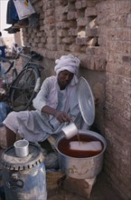 SUDAN, Markets, Cold drinks seller at roadside stall.