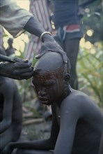 SUDAN, Tribal People, "Dinka initiation into manhood.  Scarring ceremony in which each boy has six