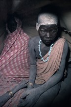 SUDAN, Tribal People, Dinka bride in hut after pre-wedding abduction.