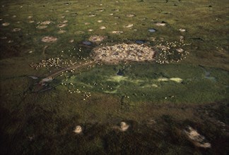 SUDAN, Traditional Housing, Aerial view over Dinka cattle camp during the wet season.