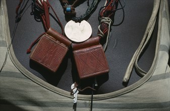 SUDAN, Mornei Settlement, Close view of leather pouches containing verses of the Koran worn around