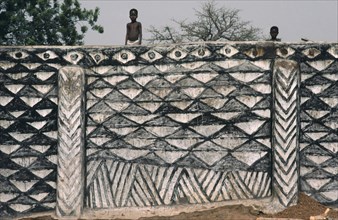 GHANA, Architecture, "Children on top of outside wall decorated with traditional broken calabash
