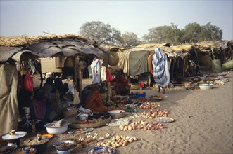 CHAD, Mao, People selling fruit and vegetables and other food stuffs from under market shelters