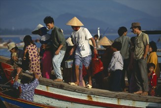 VIETNAM, Nha Trang, People from offshore islands disembarking from ferry at shore at Cau Dua