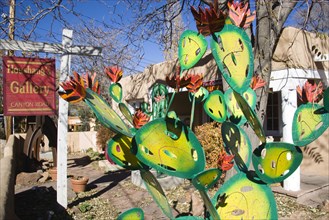 USA, New Mexico, Santa Fe, Houshangs art gallery on Canyon Road with a colourful metal sculpture of