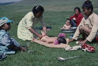 MONGOLIA, People, Traditional massage for sickly babies