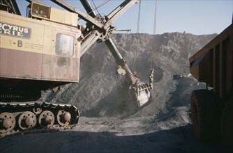MAURITANIA, Zouerate, Extraction of iron ore by heavy machinery in mine.