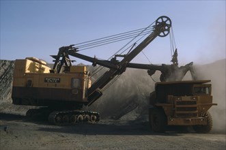 MAURITANIA, Zouerate, Extraction of iron ore by machinery in mine.