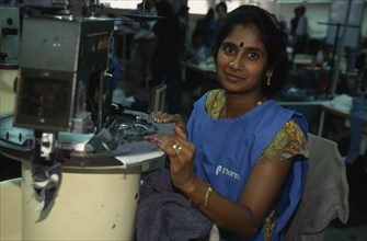 MAURITIUS, Floreal, Freezone.  Young woman working in textile factory.