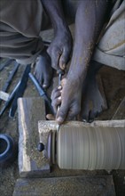 MALAWI, Zalewa, Kadzuwa Crafts.  Cropped view of craftsman using wood turner to produced fair trade