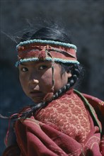 BOLIVIA, Tribal People, Portrait of young girl with hair in plaits and wearing woven head band