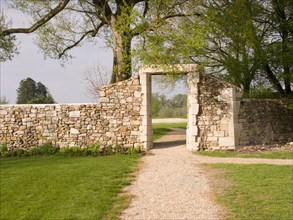 FRANCE, Deux Sevres Region, Poitiers, A doorway in the old stone wall surrounding the Chateau des