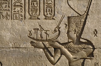 EGYPT, Nile Valley, Dendara, Temple of Hathor.  Detail of frieze depicting the pharaoh making