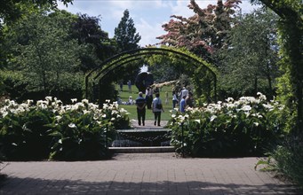 ENGLAND, Surrey, Woking, Wisley Royal Horticultural Society Garden. Visitors walking along pathway