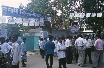BANGLADESH, Dhaka, Men gathered at voting centre for municipal elections.