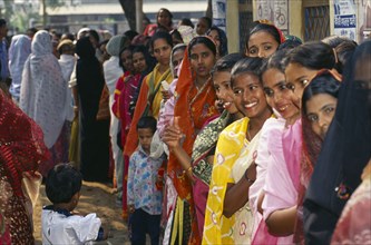 BANGLADESH, Dhaka, Crowd of women waiting in line at polling station to vote in local elections.