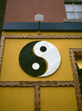 IRELAND, Dublin, "Yin and Yang symbol painted onto a wall. Yin Yang originates in ancient Chinese