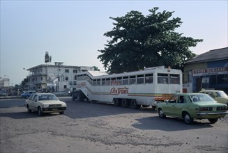 CONGO, Kinshasa, Street scene with bus and other traffic.