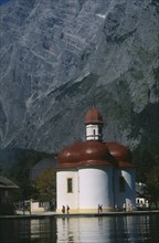 GERMANY, Berchtesgaden, Konigssee, The red wooden tiled baroque church of Saint Bartholoma.
