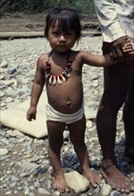 PANAMA, Candelaria, Choco Indian girl wearing monkey tooth necklace.