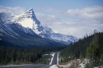 CANADA, Alberta, Banff National Park, Trans-Canada highway through mountain landscape with pine