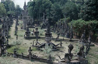THAILAND, Nong Khai, Wat Khaek, Buddha park. Collection of religious statues in a garden