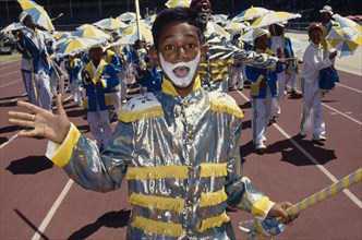SOUTH AFRICA, Western Cape, Cape Town, Young boy in costume and face paint taking part in Cape Coon