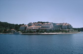 CROATIA, Dalmatia, Mljet, Hotel Odisej seen from across water