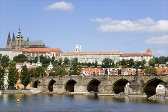 CZECH REPUBLIC, Bohemia, Prague, View across the Vtlava River to Charles Bridge with St Vitus