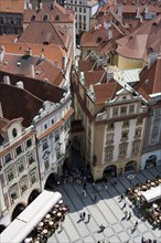 CZECH REPUBLIC, Bohemia, Prague, Restaurant and cafe tables with strolling pedestrians in the Old
