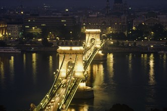 HUNGARY, Budapest, Bridge of Chains over the River Danube illuminated at night with lights from