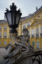 HUNGARY, Fertöd, Eszterhazy Palace, Detail of carved stone balustrade and lamp with part view of