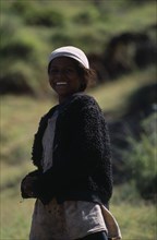 MADAGASCAR, People, Children , Portrait of a girl smiling wearing a white hat and black jacket