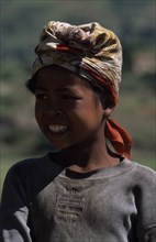 MADAGASCAR, People, Children , Portrait of a girl wearing a headscarf