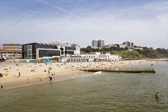 ENGLAND, Dorset, Bournemouth, The East Beach with seafront restaurants and bars. Adults and