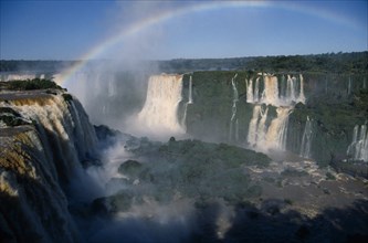BRAZIL, Foz do Iguacu, A rainbow over the Floriana Falls.