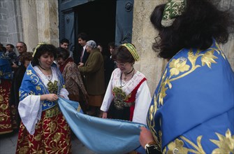 ITALY, Sicily, Palermo, Piana Degli Albanesi.  Women celebrating Easter wearing traditional costume