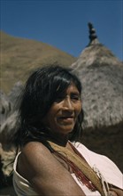 COLOMBIA, Sierra Nevada de Santa Marta, Kogi Tribe, Portrait of older woman wearing necklace of