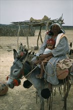 COLOMBIA, Guajira Peninsula, Guajiro / Wayuu Tribe, "Portrait of Wayuu mother with baby daughter.