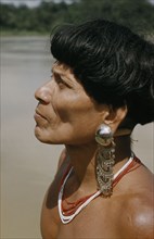 COLOMBIA, Choco Region, Noanama Tribe, "Headman with ornate silver earplugs, coloured glass bead