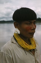 COLOMBIA, Choco Region, Noanama Tribe, "Teenager decked out with traded, yellow, glass bead