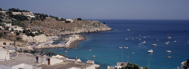 ITALY, Puglia, The village of Castro Marina on the South Adriatic Sea coast. Boats at sea and in