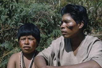 COLOMBIA, Sierra de Perija, Yuko - Motilon , Gabriel and his wife with bright red “Achiote” facial