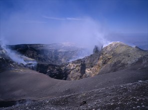 ITALY, Sicily, Mount Etna, Sulphur coated edge of the smoking summit crater